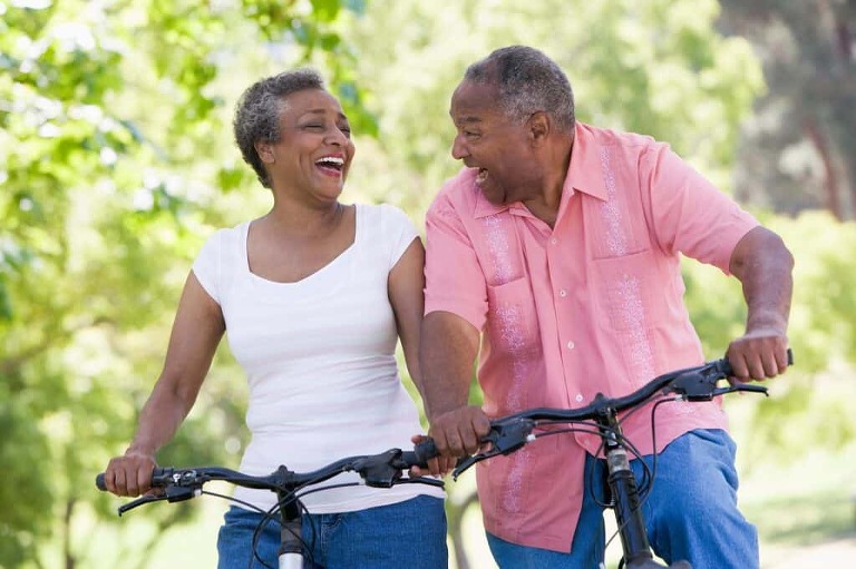 exercise for sciatica elderly couple out on bike ride