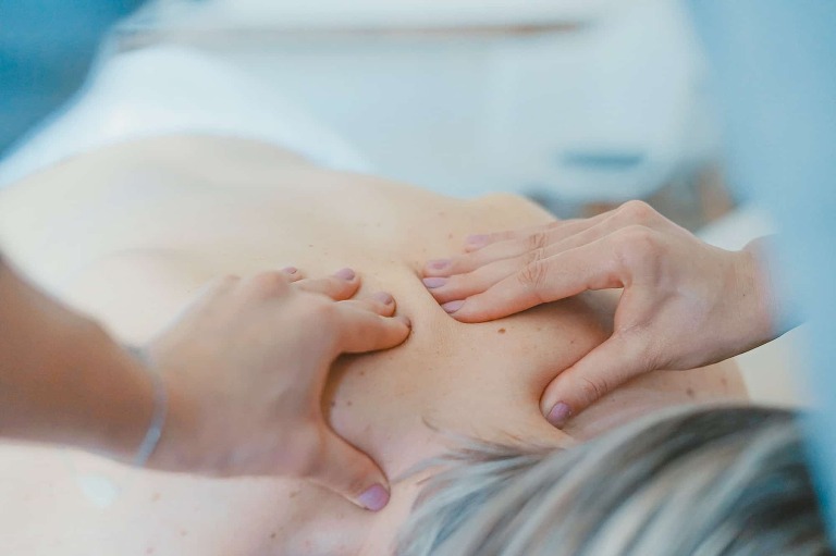 chiropractor treating sciatica with massage.